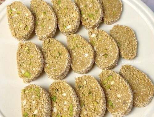 Sliced Til Mawa Roll on a festive plate for Makar Sankranti